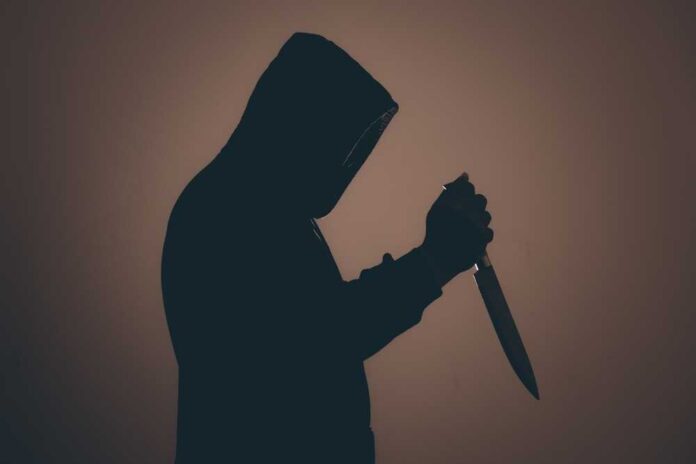 Silhouette,Of,A,Man,Wearing,A,Black,Hoodie,And,Face