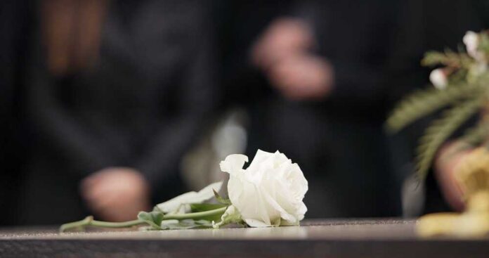 Funeral,,Rose,And,Flower,On,Coffin,In,Cemetery,For,Outdoor