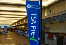 TSA PreCheck sign in an airport terminal