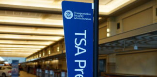 TSA PreCheck sign in an airport terminal