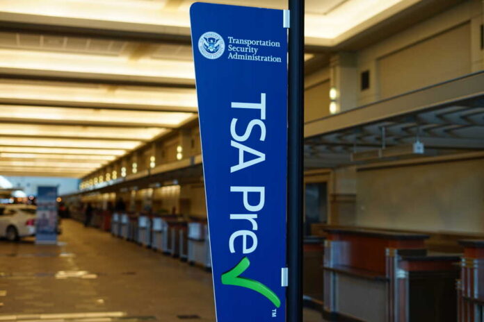 TSA PreCheck sign in an airport terminal