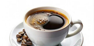 Cup of coffee with coffee beans on saucer