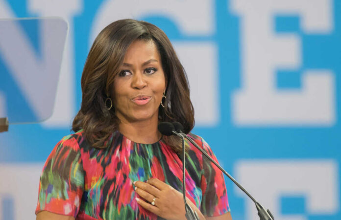 Woman speaking at a podium in colorful dress