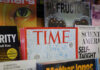 Display of various magazines including TIME magazine