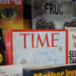 Display of various magazines including TIME magazine