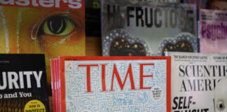 Display of various magazines including TIME magazine