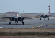 F-35s Arrive Unready for Combat—A Tactical Disaster? Two F-35 fighter jets on an airfield preparing for takeoff