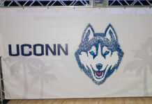 UConn’s STUNNING Comeback: Duke Left Speechless UConn Husky logo displayed on a banner