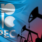 OPEC logo in front of an abstract flag background with oil rigs silhouettes