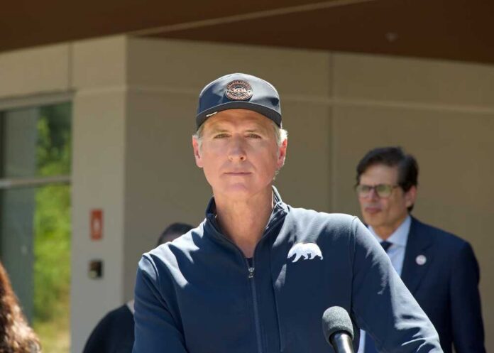 Politician speaking at a press conference outdoors
