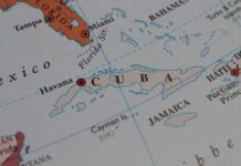 Protesters TORCH Communist Icons – Unrest Spreads Map highlighting Cuba and surrounding Caribbean islands