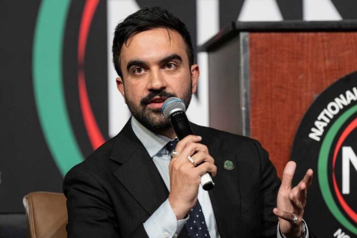 A man speaking into a microphone at a conference