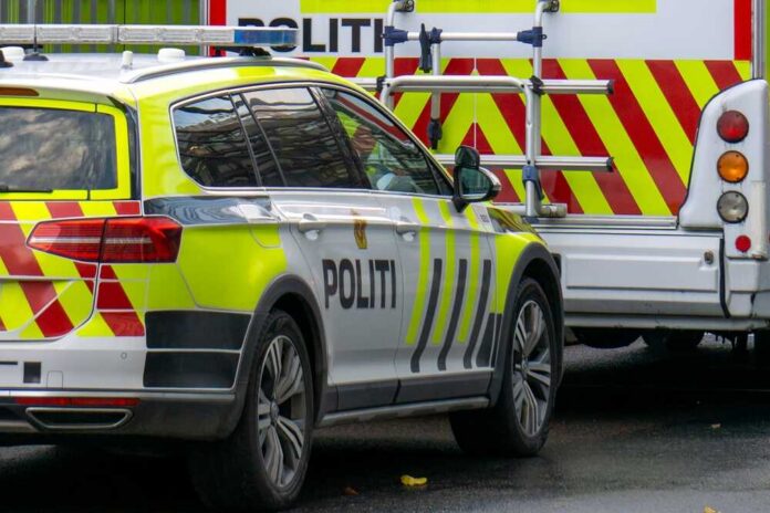 A police car parked next to an emergency vehicle with reflective markings