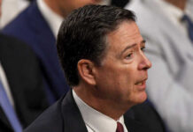 Massive Conspiracy Probe: FBI’s Comey Under Fire A man in a suit speaking during a government hearing