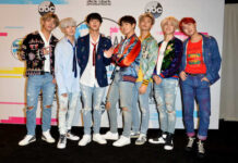 K-pop group posing together at a music awards event