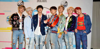 K-pop group posing together at a music awards event