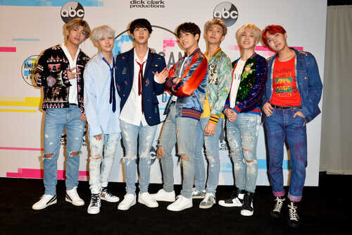K-pop group posing together at a music awards event