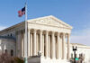 United States Supreme Court building with American flag