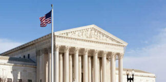 United States Supreme Court building with American flag