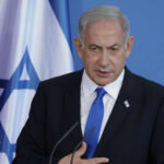 Outrage: Israeli Soldier’s Act SPARKS Global Backlash Man speaking in front of Israeli flag backdrop