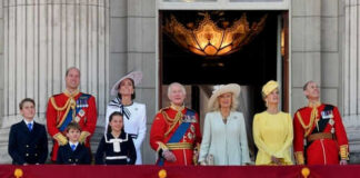 Group of people on a balcony in formal attire