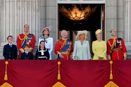 Group of people on a balcony in formal attire