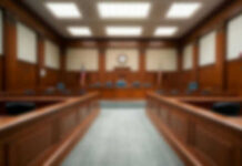 Blurred view of a courtroom with wooden furnishings