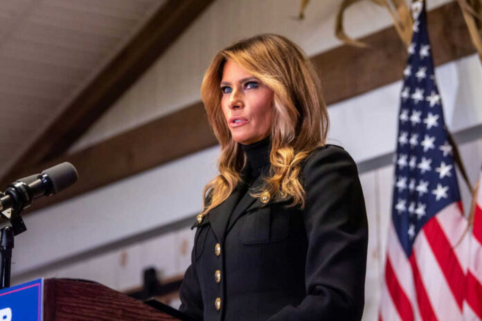 melania-trump-speaks1844860900jpg Woman speaking at podium with American flag background