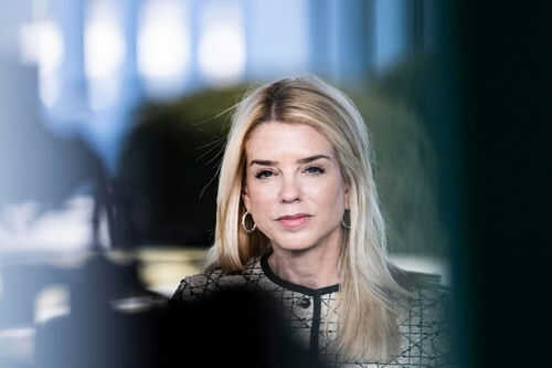 pam-bondi2588951469 Woman with long blonde hair wearing hoop earrings