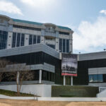 Modern building with a large banner displaying a historical quote