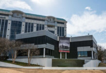Modern building with a large banner displaying a historical quote