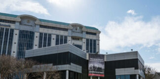Modern building with a large banner displaying a historical quote