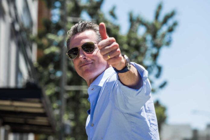 Man giving a thumbs up while wearing sunglasses