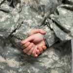 IDF CONFIRMS: Soldier’s Shocking Jesus Attack Person in military uniform with hands clasped behind their back
