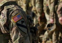 Close-up of a soldier's uniform with an American flag patch