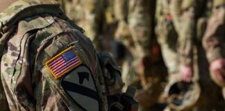 Close-up of a soldier's uniform with an American flag patch