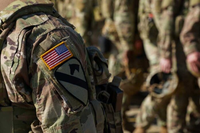 Close-up of a soldier's uniform with an American flag patch