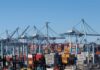 Cranes and shipping containers at a busy port