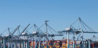Cranes and shipping containers at a busy port