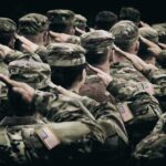Military Retirement Dream? Only 20% Make It Group of soldiers in uniform saluting during a ceremony