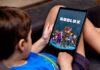 Child playing Roblox on a tablet