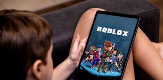 Child playing Roblox on a tablet