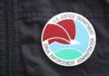 Close-up of a Drug Enforcement Administration badge on a black jacket