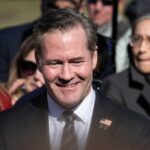 UN ‘Political Theatre’ BLASTED by Ambassador Waltz A smiling man in a suit at a political event surrounded by a crowd