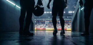 Football players standing in a tunnel before entering the stadium