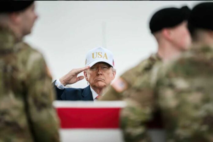 A man in a USA hat saluting during a military ceremony