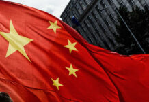 Close-up of the Chinese flag waving in the wind