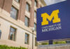 University of Michigan sign outside brick building