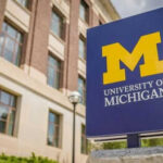 University of Michigan sign outside brick building