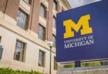 University of Michigan sign outside brick building